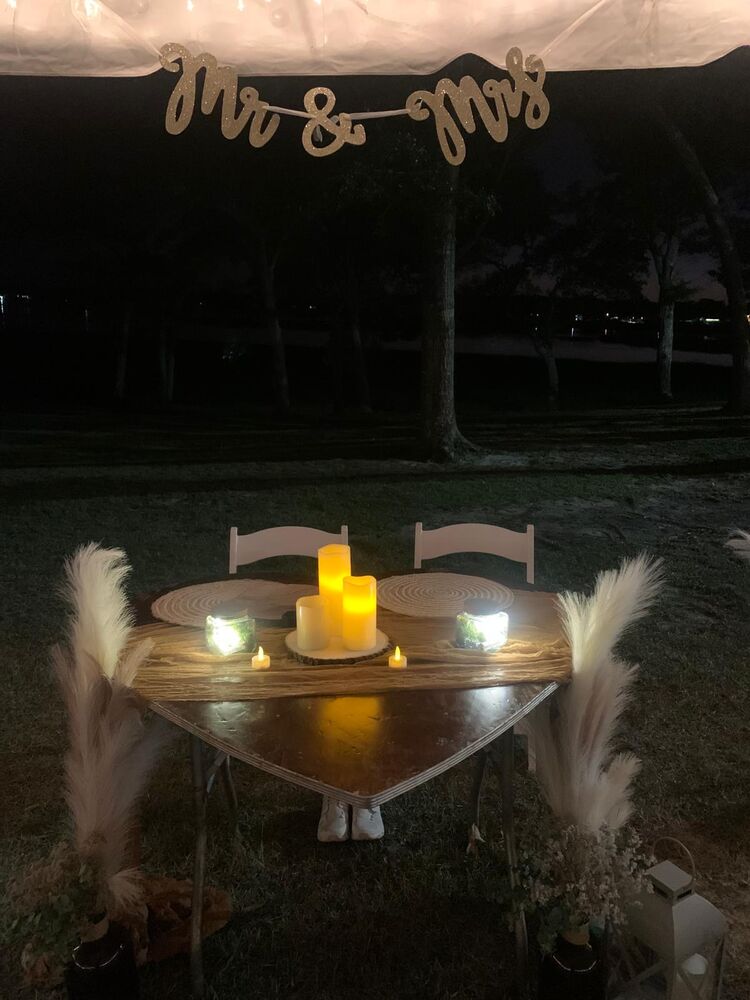 Romantic candlelit Mr. & Mrs. table at night