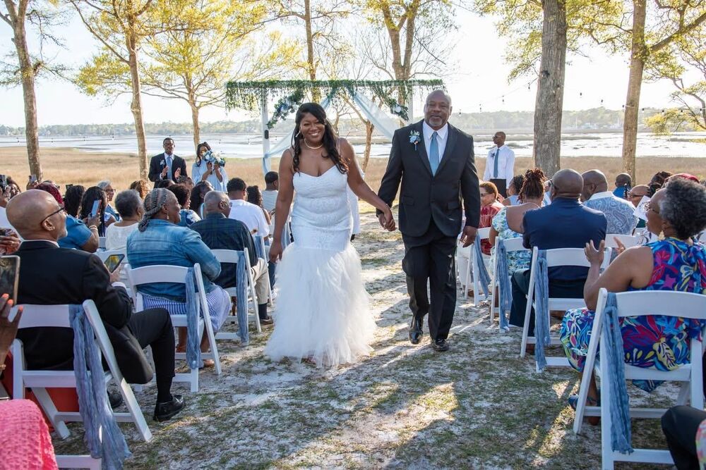 Bride and groom walking the aisle at Cox Landing